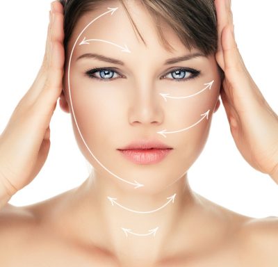 Laser therapy on pretty woman face, isolated over white